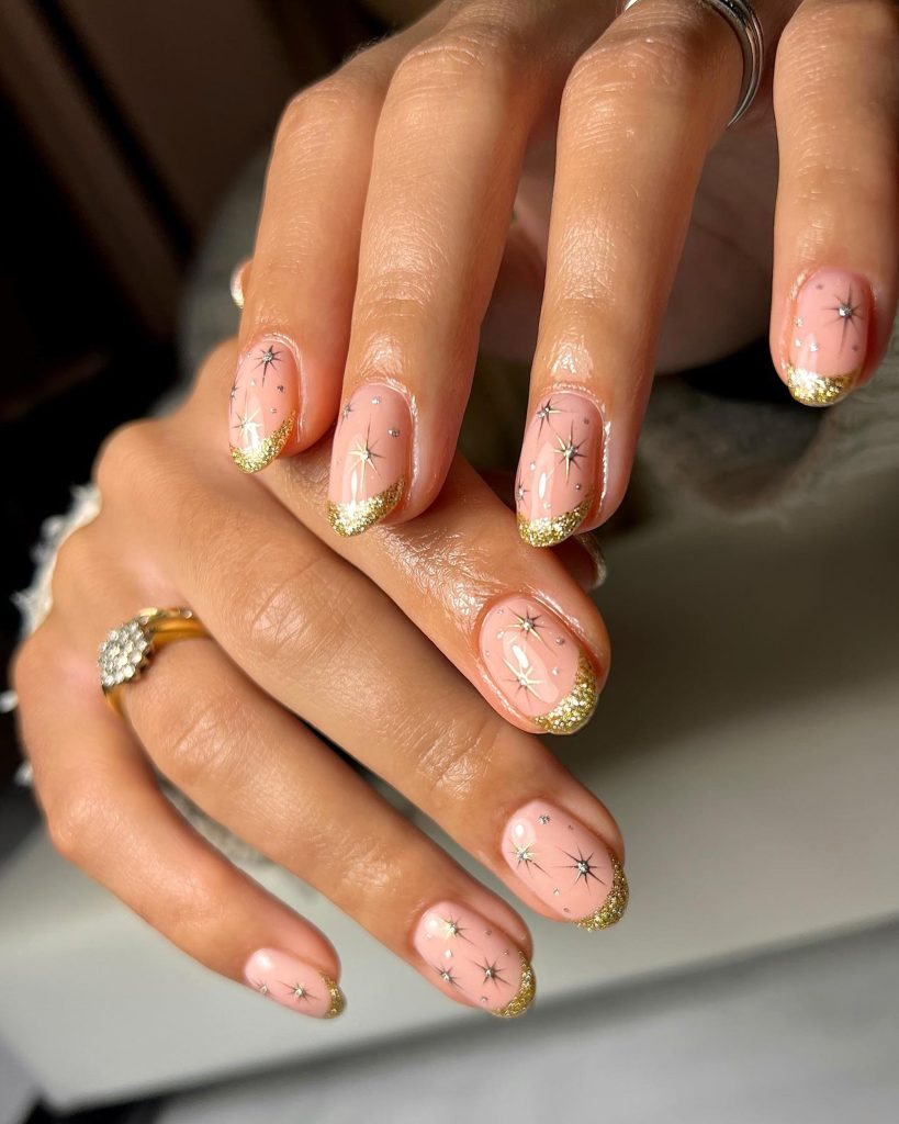 Elegant Nude Nails with Gold Glitter Tips