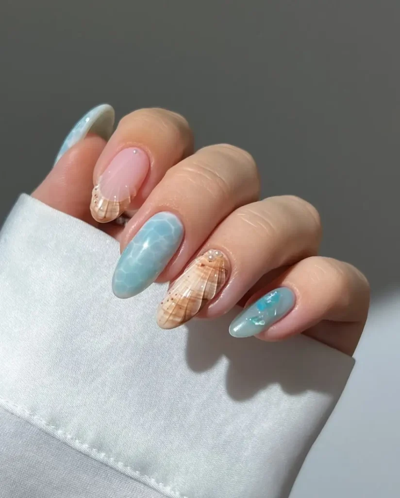 Seashell Elegance Meets Ocean Glow in Classy Beach Nails