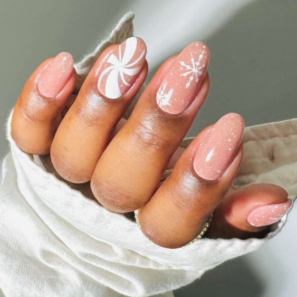 Sparkly Peach Almond Nails with Cute Floral Accents