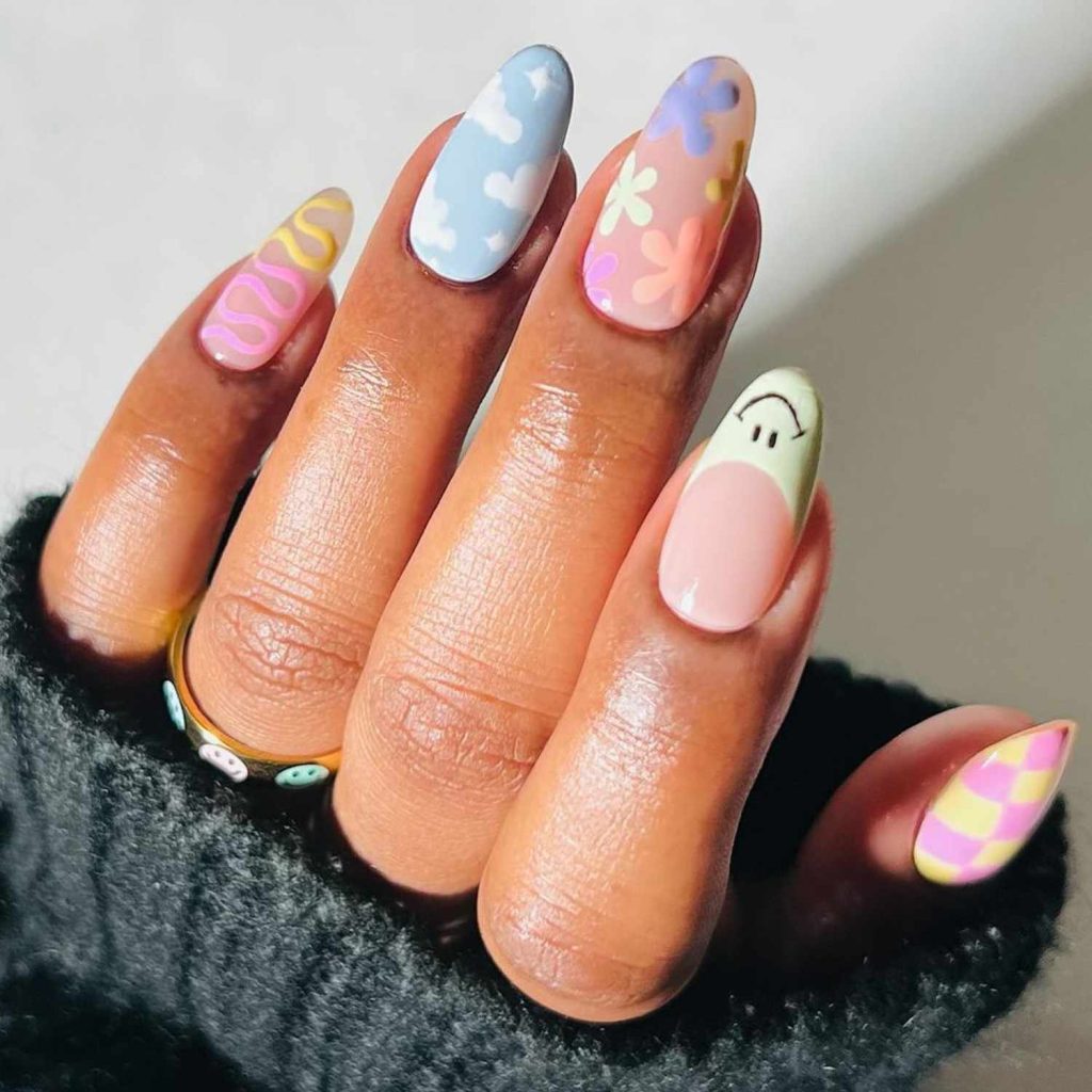Ultra-realistic, hyper-detailed, 8K cinematic portrait of a young stylish man, using the uploaded image for exact face and hairstyle.
Outfit: A colorful printed Hawaiian-style shirt with abstract mountain and tropical patterns, paired with light blue loose-fit jeans.
Pose: Standing indoors in a modern café with short black hair styled neatly, one hand in his pocket, and the other hand holding a plastic cup of iced coffee.
Playful Pastel Mix Nails That Turn Every Finger Into Art