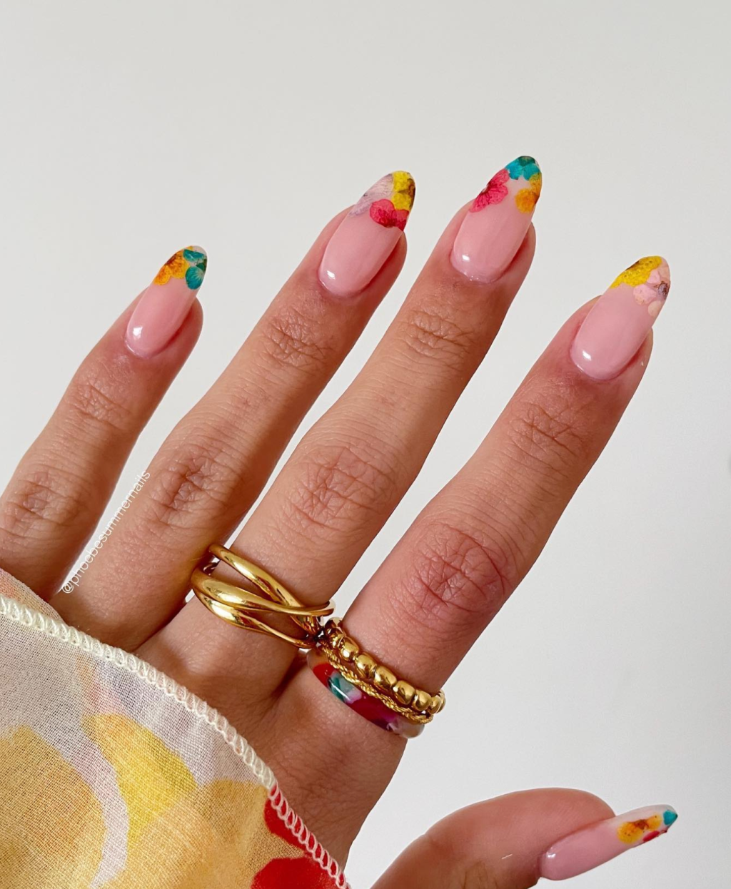 Bright Spring Nails with colorful floral nail art, vibrant French tips, abstract swirl designs, and trendy spring manicure inspiration