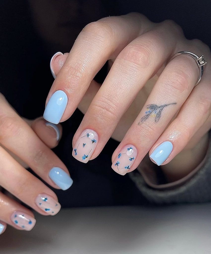 Soft Baby Blue Nails With Tiny Floral Elegance